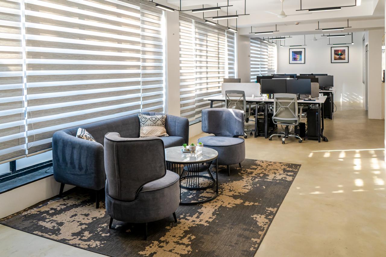 Office lounge seating area with textured rug